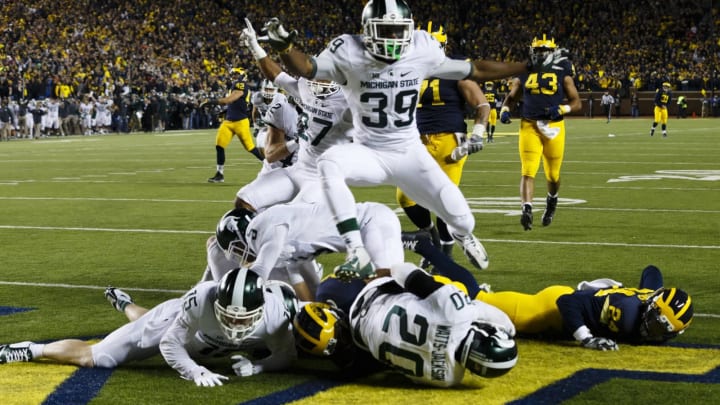 Oct 17, 2015; Ann Arbor, MI, USA; Michigan State Spartans defensive back Jalen Watts-Jackson (20) dives into the end zone for a game winning touchdown as the clock runs out in the fourth quarter against the Michigan Wolverines at Michigan Stadium. Michigan State 27-23. Mandatory Credit: Rick Osentoski-USA TODAY Sports