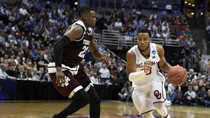 March 24, 2016; Anaheim, CA, USA; Oklahoma Sooners guard Jordan Woodard (10) moves to the basket against Texas A&M Aggies guard Danuel House (23) during the second half of the semifinal game in the West regional of the NCAA Tournament at Honda Center. Mandatory Credit: Richard Mackson-USA TODAY Sports