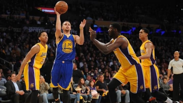 January 5, 2016; Los Angeles, CA, USA; Golden State Warriors guard Stephen Curry (30) moves to the basket against Los Angeles Lakers center Roy Hibbert (17) during the first half at Staples Center. Mandatory Credit: Gary A. Vasquez-USA TODAY Sports