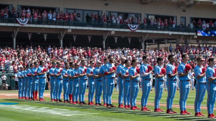 Jun 8, 2019; Fayetteville, AR, USA; Mississippi Rebels players and coaches line up for the National Anthem before their game against the Arkansas Razorbacks at Baum-Walker Stadium. Mandatory Credit: Brett Rojo-USA TODAY Sports