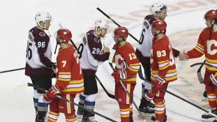 CALGARY, AB - APRIL 19: Colorado Avalanche right wing Mikko Rantanen (96), center Nathan MacKinnon (29) and defenseman Erik Johnson (6) shake hands with Calgary Flames defenseman TJ Brodie (7), left wing Johnny Gaudreau (13), center Sam Bennett (93) and Calgary Flames center Sean Monahan (23) after winning 5-1 to take the series 4-1 in the at the Scotiabank Saddledome for game five playoffs April 19, 2019. (Photo by Andy Cross/MediaNews Group/The Denver Post via Getty Images)