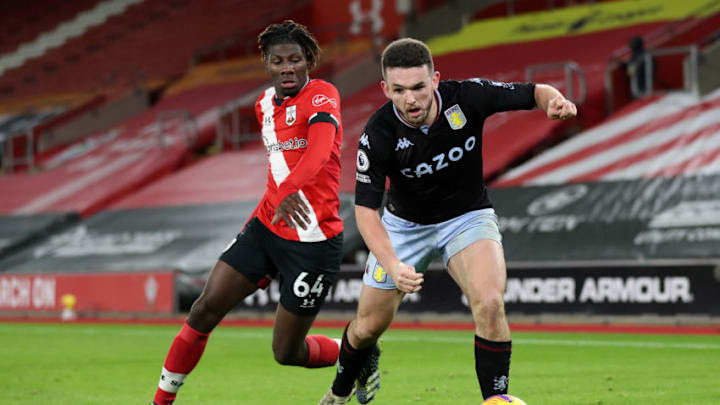 SOUTHAMPTON, ENGLAND - JANUARY 30: John McGinn of Aston Villa is challenged by Alex Jankewitz of Southampton during the Premier League match between Southampton and Aston Villa at St Mary's Stadium on January 30, 2021 in Southampton, England. Sporting stadiums around the UK remain under strict restrictions due to the Coronavirus Pandemic as Government social distancing laws prohibit fans inside venues resulting in games being played behind closed doors. (Photo by Naomi Baker/Getty Images)
