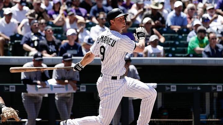 Jun 14, 2016; Denver, CO, USA; Colorado Rockies second baseman DJ LeMahieu (9) hits a single in the seventh inning against the New York Yankees at Coors Field. The Rockies won 13-10. Mandatory Credit: Isaiah J. Downing-USA TODAY Sports