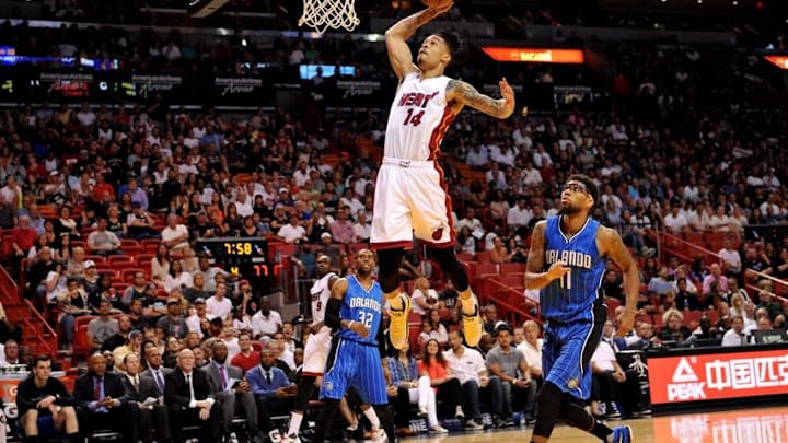 Apr 10, 2016; Miami, FL, USA; Miami Heat forward Gerald Green (14) dunks the ball as Orlando Magic forward Devyn Marble (11) looks on during the second half at American Airlines Arena. The Heat won 118-96. Mandatory Credit: Steve Mitchell-USA TODAY Sports