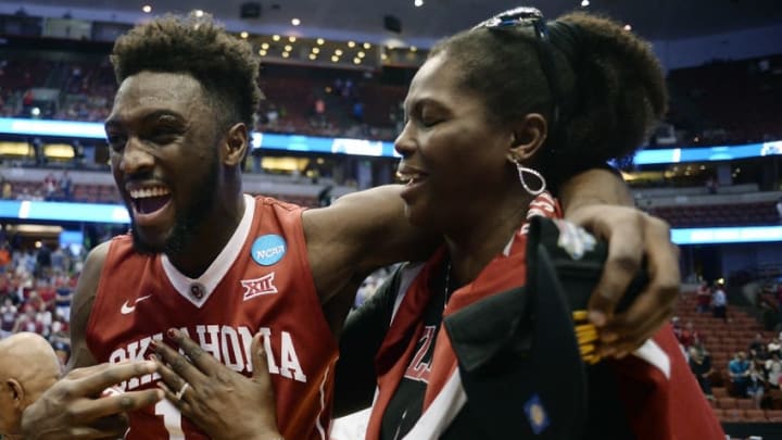 March 26, 2016; Anaheim, CA, USA; Oklahoma Sooners forward Khadeem Lattin (12) celebrates with his mother Monica Lamb the 80-68 victory against Oregon Ducks o win the West regional final of the NCAA Tournament at Honda Center. Mandatory Credit: Robert Hanashiro-USA TODAY Sports