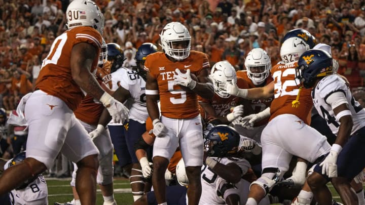 Oct 1, 2022; Austin, Texas, USA; Texas Longhorns running back Bijan Robinson (5) walks into the endzone for a touchdown against the West Virginia Mountaineers during a game at Royal Memorial Stadium. Mandatory Credit: Aaron E. Martinez/American-Statesman via USA TODAY NETWORK