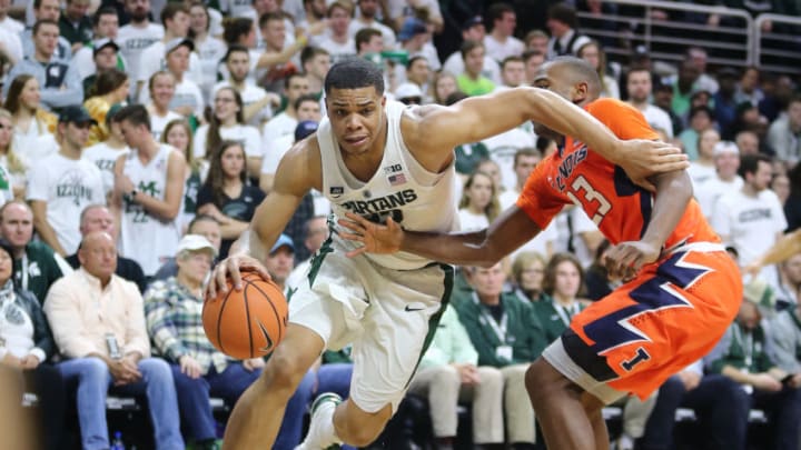 Miles Bridges #22 of the Michigan State Spartans drives to the basket while defended by Aaron Jordan #23 of the Illinois Fighting Illini at Breslin Center on February 20, 2018 in East Lansing, Michigan. (Photo by Rey Del Rio/Getty Images)