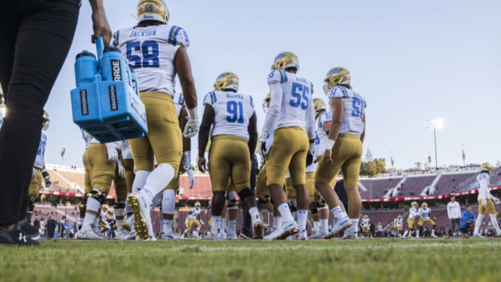 PALO ALTO, CA - OCTOBER 17: Members of the UCLA Bruins football team warm up before an NCAA Pac-12 college football game against the Stanford Cardinal on October 17, 2019 at Stanford Stadium in Palo Alto, California. (Photo by David Madison/Getty Images)