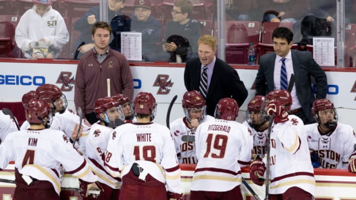 CHESTNUT HILL, MA - OCTOBER 28: Associate Coach Greg Brown of the Boston College Eagles stands behind the bench as he fills-in for head coach Jerry York who is recovering from eye surgery during NCAA hockey against the Providence College Friars at Kelley Rink on October 28, 2016 in Chestnut Hill, Massachusetts. The Eagles won 3-1. (Photo by Richard T Gagnon/Getty Images)