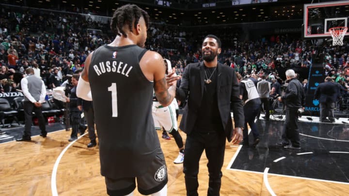 BROOKLYN, NY - MARCH 30: D'Angelo Russell #1 of the Brooklyn Nets and Kyrie Irving #11 of the Boston Celtics hug after the game on March 30, 2019 at Barclays Center in Brooklyn, New York. NOTE TO USER: User expressly acknowledges and agrees that, by downloading and or using this Photograph, user is consenting to the terms and conditions of the Getty Images License Agreement. Mandatory Copyright Notice: Copyright 2019 NBAE (Photo by Nathaniel S. Butler/NBAE via Getty Images)