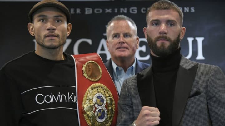 LOS ANGELES, CA - JANUARY 11: Promoter Tom Brown stands behind Jose Uzcategui (L) with his belt and Caleb Plant ahead of their IBF Super Middleweight bout while at the Westin Bonaventure Hotel on January 11, 2019 in Los Angeles, California. (Photo by John McCoy/Getty Images)