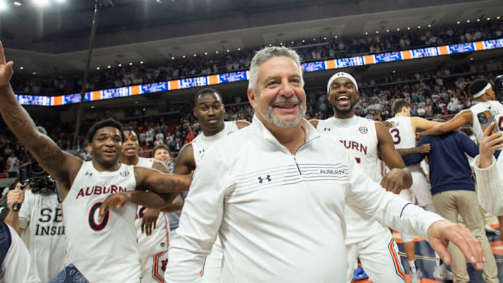 AUBURN, ALABAMA - FEBRUARY 01: Head coach Bruce Pearl of the Auburn Tigers celebrates with his team after defeating the Alabama Crimson Tide at Auburn Arena on February 01, 2022 in Auburn, Alabama. (Photo by Michael Chang/Getty Images)