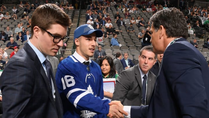 DALLAS, TX – JUNE 23: Sean Durzi greets his team after being selected 52nd overall by the Toronto Maple Leafs during the 2018 NHL Draft at American Airlines Center on June 23, 2018 in Dallas, Texas. (Photo by Brian Babineau/NHLI via Getty Images)