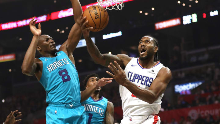 LOS ANGELES, CALIFORNIA – OCTOBER 28: Kawhi Leonard #2 of the Los Angeles Clippers drives to the basket as Malik Monk #1 and Bismack Biyombo #8 of the Charlotte Hornets defend during the first half of a game at Staples Center on October 28, 2019 in Los Angeles, California. NOTE TO USER: User expressly acknowledges and agrees that, by downloading and or using this photograph, User is consenting to the terms and conditions of the Getty Images License Agreement. (Photo by Sean M. Haffey/Getty Images)