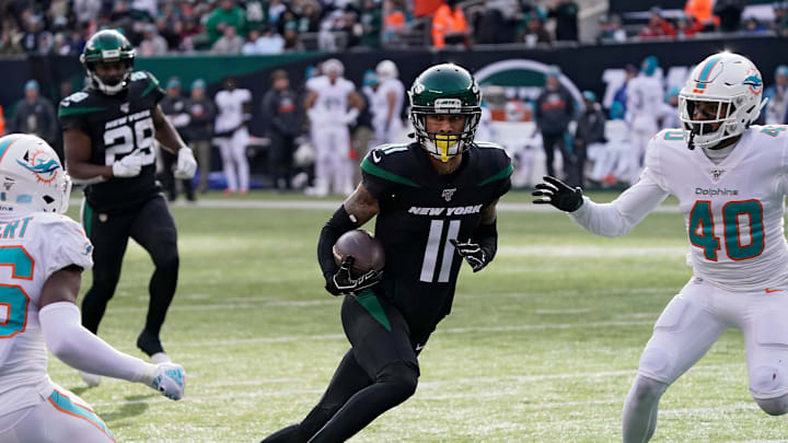EAST RUTHERFORD, NJ – DECEMBER 8: Robby Anderson #11 of the New York Jets runs to the end zone past Adrian Colbert #36 and Nik Needham #40 of the Miami Dolphins for a touchdown after catching a pass in an NFL football game on December 8, 2019 at MetLife Stadium in East Rutherford, New Jersey. Jets won 22-21. (Photo by Paul Bereswill/Getty Images)