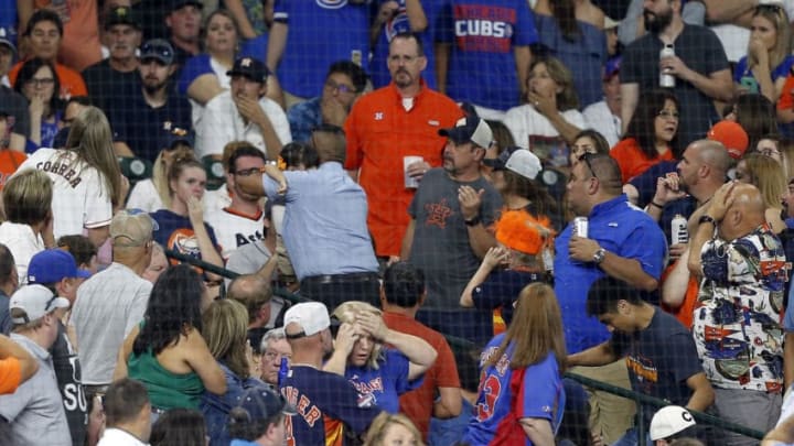 HOUSTON, TEXAS - MAY 29: A young child is rushed from the stands after being injured by a hard foul ball off the bat of Albert Almora Jr. #5 of the Chicago Cubs in the fourth inning at Minute Maid Park on May 29, 2019 in Houston, Texas. (Photo by Bob Levey/Getty Images)