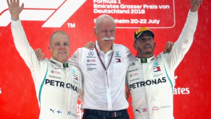 HOCKENHEIM, GERMANY - JULY 22: Race winner Lewis Hamilton of Great Britain and Mercedes GP celebrates with second placed Valtteri Bottas of Finland and Mercedes GP and Head of Mercedes Cars Dieter Zetsche on the podium during the Formula One Grand Prix of Germany at Hockenheimring on July 22, 2018 in Hockenheim, Germany. (Photo by Mark Thompson/Getty Images)