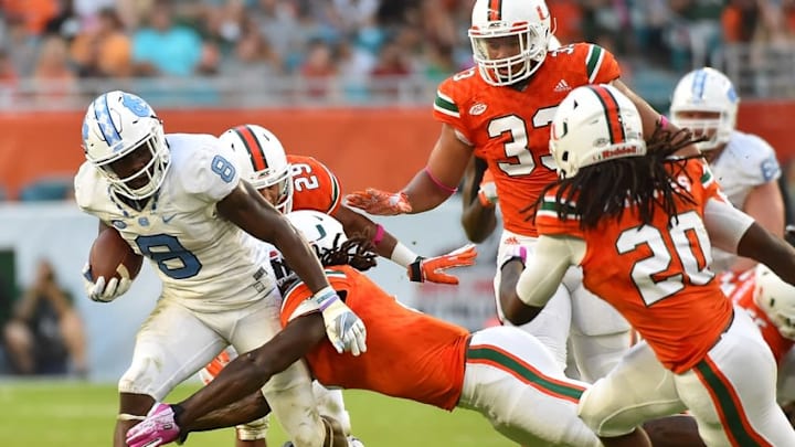 Oct 15, 2016; Miami Gardens, FL, USA; North Carolina Tar Heels running back T.J. Logan (8) runs the ball against the Miami Hurricanes during the second half at Hard Rock Stadium. The North Carolina Tar Heels defeat the Miami Hurricanes 20-13. Mandatory Credit: Jasen Vinlove-USA TODAY Sports