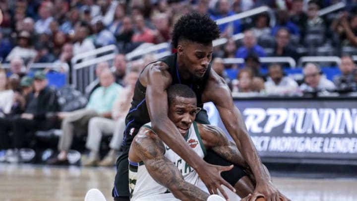 ORLANDO, FL - JANUARY 19: Jonathan Isaac #1 of the Orlando Magic fights with Eric Bledsoe #6 of the Milwaukee Bucks over a loose ball during the game at the Amway Center on January 19, 2019 in Orlando, Florida. The Bucks defeated The Magic 118 to 108. (Photo by Don Juan Moore/Getty Images)