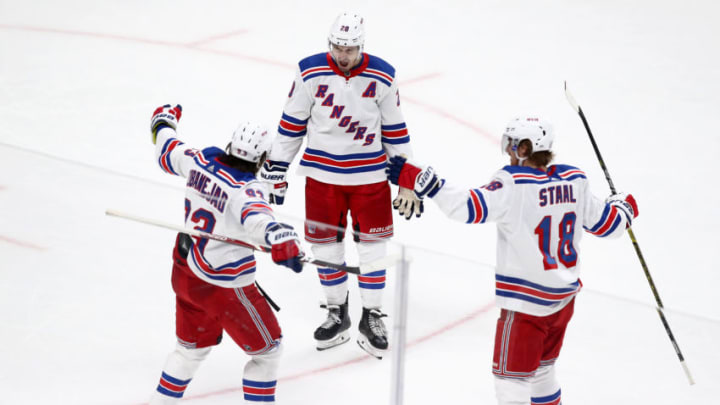 SAN JOSE, CALIFORNIA - DECEMBER 12: Chris Kreider #20 and Marc Staal #18 celebrate with Mika Zibanejad #93 of the New York Rangers after Zibanejad scored a goal against the San Jose Sharks at SAP Center on December 12, 2019 in San Jose, California. (Photo by Ezra Shaw/Getty Images)