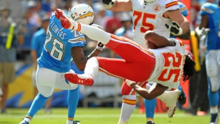 Oct 19, 2014; San Diego, CA, USA; San Diego Chargers cornerback Brandon Flowers (26) and Kansas City Chiefs running back Jamaal Charles (25) collide as Charles crosses the goal line for a touchdown during the second quarter at Qualcomm Stadium. Mandatory Credit: Jake Roth-USA TODAY Sports