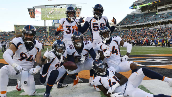 CINCINNATI, CO - DECEMBER 02: Denver Broncos teammates from left to right, Domata Sr. Peko (94), Su'a Cravens (21), Denver Broncos free safety Justin Simmons (31), Von Miller (58), Will Parks (34) and Isaac Yiadom (41) celebrate with Denver Broncos outside linebacker Bradley Chubb (55), center, after Chubb forced a fumble from Cincinnati Bengals quarterback Jeff Driskel (6) and recovered in the forth quarter at Paul Brown Stadium December 02, 2018. Broncos won 24-10. (Photo by Andy Cross/The Denver Post via Getty Images)