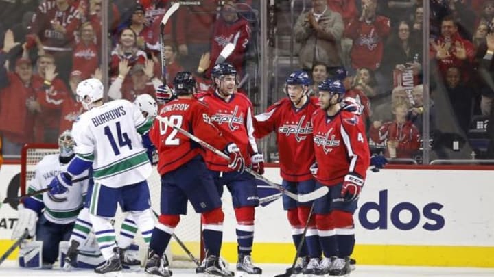 Jan 14, 2016; Washington, DC, USA; Washington Capitals right wing Tom Wilson (43) celebrates with teammates after scoring a goal against Vancouver Canucks goalie Ryan Miller (30) in the third period at Verizon Center. The Capitals won 4-1. Mandatory Credit: Geoff Burke-USA TODAY Sports
