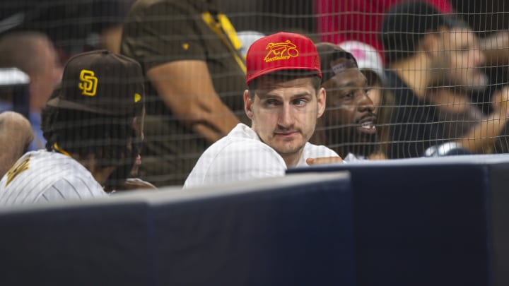 SAN DIEGO, CA – SEPTEMBER 27: Center Nikola Jokic of the Denver Nuggets watches on as the San Diego Padres face against the Los Angeles Dodgers at PETCO Park on September 27, 2022 in San Diego, California. (Photo by Matt Thomas/San Diego Padres/Getty Images)
