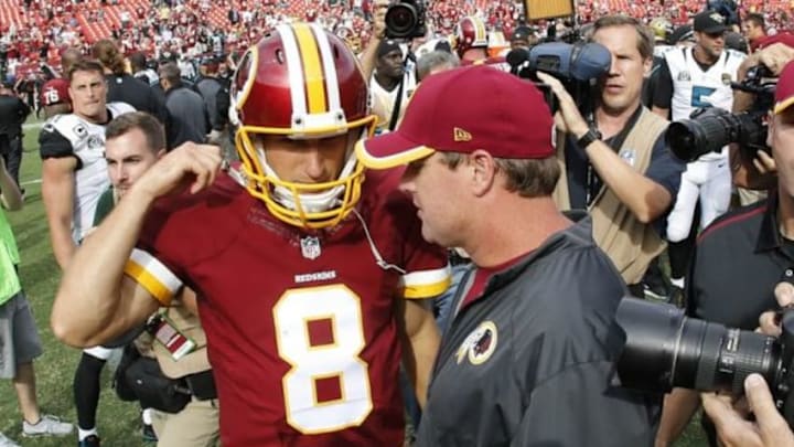 Sep 14, 2014; Landover, MD, USA; Washington Redskins quarterback Kirk Cousins (8) talks with Redskins head coach Jay Gruden (R) after their game at FedEx Field. The Redskins won 41-10. Mandatory Credit: Geoff Burke-USA TODAY Sports