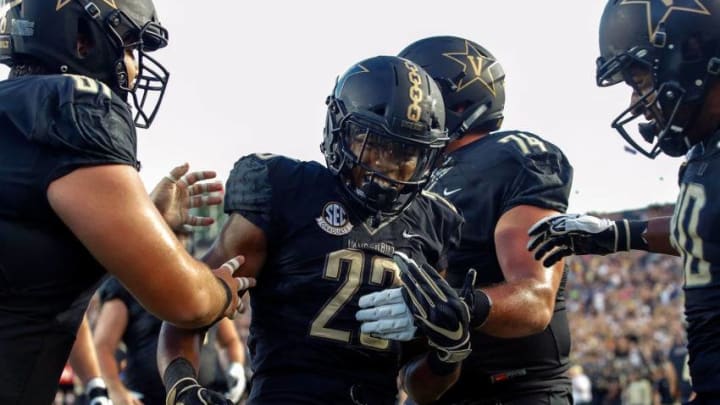 NASHVILLE, TN - SEPTEMBER 01: Khari Blasingame #23 of the Vanderbilt Commodores is congratulated by teammates after scoring a touchdown against the Middle Tennessee Blue Raiders during the first half at Vanderbilt Stadium on September 1, 2018 in Nashville, Tennessee. (Photo by Frederick Breedon/Getty Images)