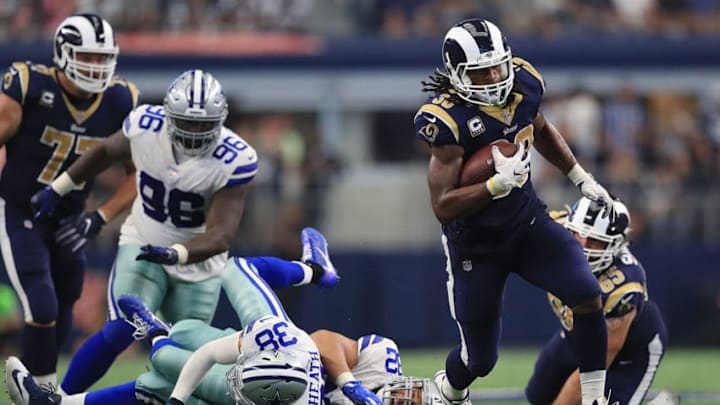 ARLINGTON, TX - OCTOBER 01: Todd Gurley #30 of the Los Angeles Rams runs the ball past Jeff Heath #38 and Brian Price #92 of the Dallas Cowboys in the third quarter at AT&T Stadium on October 1, 2017 in Arlington, Texas. (Photo by Ronald Martinez/Getty Images)