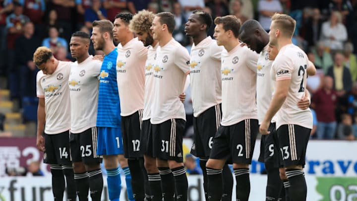 BURNLEY, ENGLAND - SEPTEMBER 02: Man Utd players observe a minute's silence in memory of former Burnley player Jimmy McIlroy before the Premier League match between Burnley and Manchester United at Turf Moor on September 2, 2018 in Burnley, England. (Photo by Simon Stacpoole/Offside/Getty Images)
