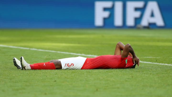 SAINT PETERSBURG, RUSSIA - JULY 03: Manuel Akanji of Switzerland looks dejected following his sides defeat in the 2018 FIFA World Cup Russia Round of 16 match between Sweden and Switzerland at Saint Petersburg Stadium on July 3, 2018 in Saint Petersburg, Russia. (Photo by Patrick Smith - FIFA/FIFA via Getty Images)