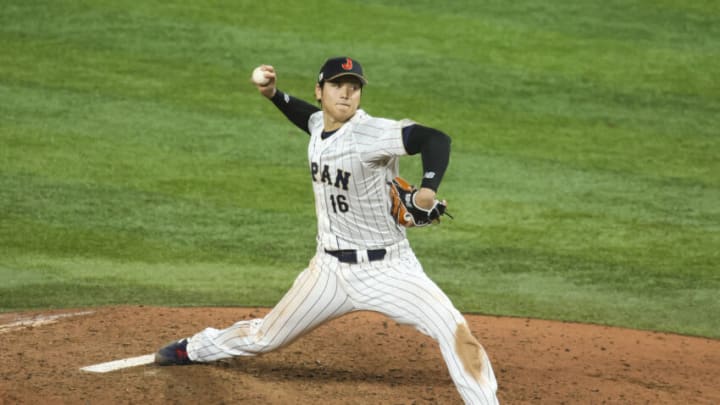 Mar 21, 2023; Miami, Florida, USA; Japan relief pitcher Shohei Ohtani (16) delivers a pitch during the ninth inning against the USA at LoanDepot Park. Mandatory Credit: Sam Navarro-USA TODAY Sports