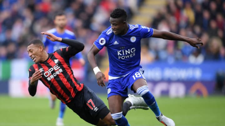 LEICESTER, ENGLAND - SEPTEMBER 22: Rajiv van La Parra of Huddersfield Town is challenged by Daniel Amartey of Leicester City during the Premier League match between Leicester City and Huddersfield Town at The King Power Stadium on September 22, 2018 in Leicester, United Kingdom. (Photo by Laurence Griffiths/Getty Images)
