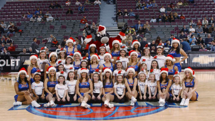 AUBURN HILLS, MI - DECEMBER 20: Members of the Automotion Dance Team pose with young girls for a Christmas photo at center court before the game between the Cleveland Cavaliers and the Detroit Pistons at Palace of Auburn Hills on December 20, 2002 in Auburn Hills, Michigan. The Pistons won in overtime 109-107. NOTE TO USER: User expressly acknowledges and agrees that, by downloading and/or using this Photograph, User is consenting to the terms and conditions of the Getty Images License Agreement. Mandatory copyright notice: Copyright 2002 NBAE (Photo by: Allen Einstein/NBAE/Getty Images)