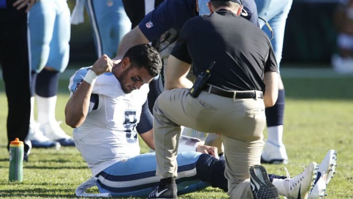Dec 24, 2016; Jacksonville, FL, USA; Tennessee Titans quarterback Marcus Mariota (8) pounds the turf following a leg injury during the third quarter of an NFL Football game against the Jacksonville Jaguars at EverBank Field. Mandatory Credit: Reinhold Matay-USA TODAY Sports