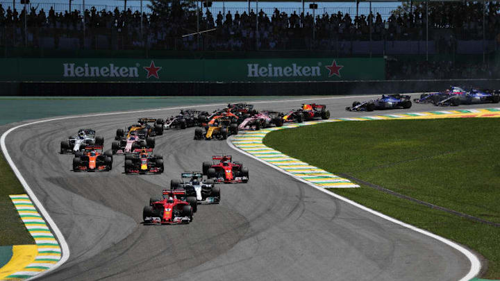 SAO PAULO, BRAZIL - NOVEMBER 12: Sebastian Vettel of Germany driving the (5) Scuderia Ferrari SF70H leads Valtteri Bottas driving the (77) Mercedes AMG Petronas F1 Team Mercedes F1 WO8 Kimi Raikkonen of Finland driving the (7) Scuderia Ferrari SF70H and the rest of the field toward turn two during the Formula One Grand Prix of Brazil at Autodromo Jose Carlos Pace on November 12, 2017 in Sao Paulo, Brazil. (Photo by Dan Istitene/Getty Images)