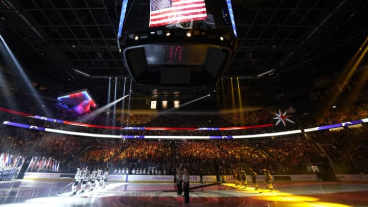 LAS VEGAS, NEVADA - NOVEMBER 13: Vegas Golden Knights and Chicago Blackhawks players stand at attention for the national anthem prior to their game at T-Mobile Arena on November 13, 2019 in Las Vegas, Nevada. (Photo by Jeff Bottari/NHLI via Getty Images)