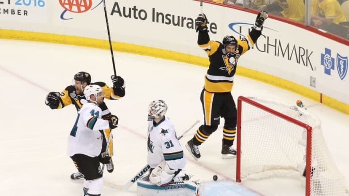 Jun 1, 2016; Pittsburgh, PA, USA; Pittsburgh Penguins center Sidney Crosby (87) and right wing Patric Hornqvist (72) celebrate after the game-winning goal by left wing Conor Sheary (not pictured) past San Jose Sharks goalie Martin Jones (31) in the overtime period of game two of the 2016 Stanley Cup Final at Consol Energy Center. Mandatory Credit: Charles LeClaire-USA TODAY Sports