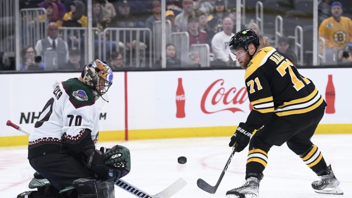 Oct. 15, 2022; Boston, Massachusetts, USA; Boston Bruins left wing Taylor Hall (71) shoots the puck on Arizona Coyotes goaltender Karel Vejmelka (70) during the third period at TD Garden. Mandatory Credit: Bob DeChiara-USA TODAY Sports