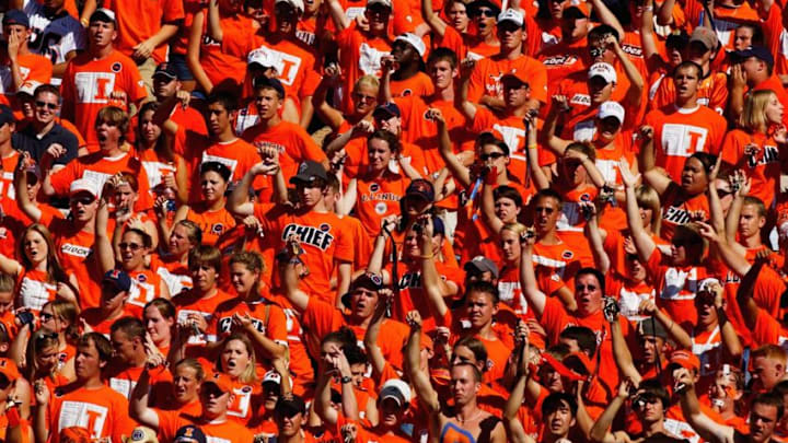 CHAMPAIGN, IL - SEPTEMBER 25: University of Illinois Fighting Illini fans cheer during the game against the Purdue University Boilermakers on September 25, 2004 at Memorial Stadium in Champaign, Illinois. Purdue defeated Illinois 38-30. (Photo by Jonathan Daniel/Getty Images)