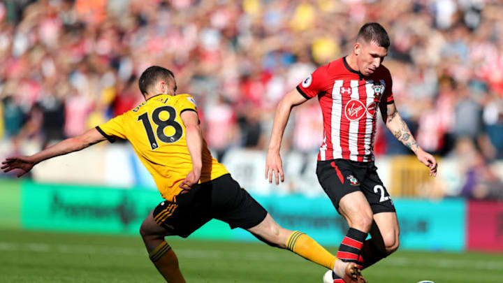 WOLVERHAMPTON, ENGLAND - SEPTEMBER 29: Pierre-Emile Hojbjerg of Southampton gets away from challenge by Diogo Jota of Wolverhampton Wanderers during the Premier League match between Wolverhampton Wanderers and Southampton FC at Molineux on September 29, 2018 in Wolverhampton, United Kingdom. (Photo by Matthew Lewis/Getty Images)