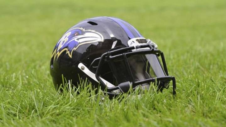 Jul 24, 2014; Owings Mills, MD, USA; A detailed view of an Baltimore Ravens helmet in the grass after practice at Under Armour Performance Center. Mandatory Credit: Tommy Gilligan-USA TODAY Sports