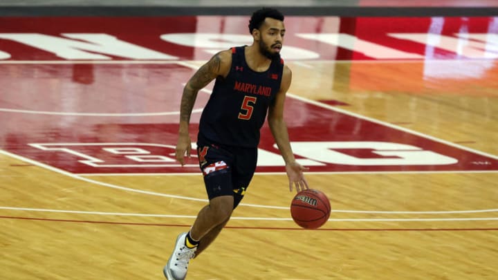 MADISON, WISCONSIN - DECEMBER 28: Eric Ayala #5 of the Maryland Terrapins handles the ball during the first half of a game against the Wisconsin Badgers at Kohl Center on December 28, 2020 in Madison, Wisconsin. (Photo by Stacy Revere/Getty Images)