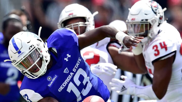 RALEIGH, NC – SEPTEMBER 08: Dan Ellington #13 of the Georgia State Panthers stretches for extra yardages as he scrambles against the North Carolina State Wolfpack during their game at Carter-Finley Stadium on September 8, 2018 in Raleigh, North Carolina. (Photo by Grant Halverson/Getty Images)