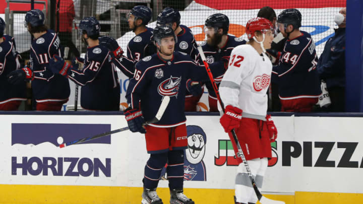 Mar 2, 2021; Columbus, Ohio, USA; Columbus Blue Jackets center Jack Roslovic (96) celebrates a goal with teammates during the second period against the Detroit Red Wings at Nationwide Arena. Mandatory Credit: Russell LaBounty-USA TODAY Sports