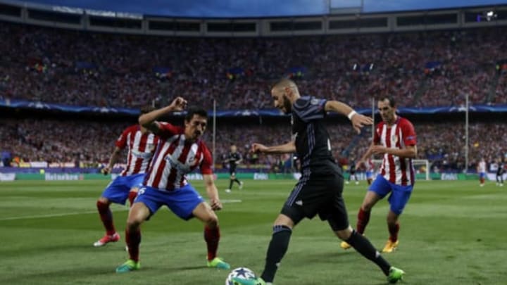 MADRID, SPAIN – MAY 10: Karim Benzema of Real Madrid is challenged by Stefan Savic of Club Atletico de Madrid during the UEFA Champions League Semi Final second leg match between Club Atletico de Madrid and Real Madrid CF at Vicente Calderon Stadium on May 10, 2017 in Madrid, Spain. (Photo by Angel Martinez/Real Madrid via Getty Images)