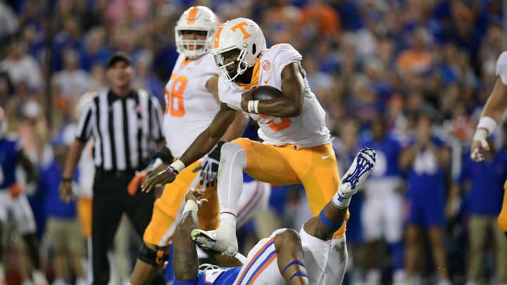 Tennessee quarterback Hendon Hooker (5) hurdles a player during the first quarter of an NCAA football game against Florida at Ben Hill Griffin Stadium in Gainesville, Florida on Saturday, Sept. 25, 2021.Tennflorida0925 0853