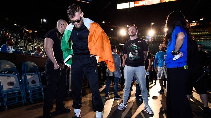LAS VEGAS, NEVADA - DECEMBER 11: (L-R) Conor McGregor of Ireland waits backstage with his coach John Kavanaugh during the UFC 194 Weigh-in event at the MGM Grand Garden Arena on December 11, 2015 in Las Vegas, Nevada. (Photo by Jeff Bottari/Zuffa LLC/Zuffa LLC via Getty Images)